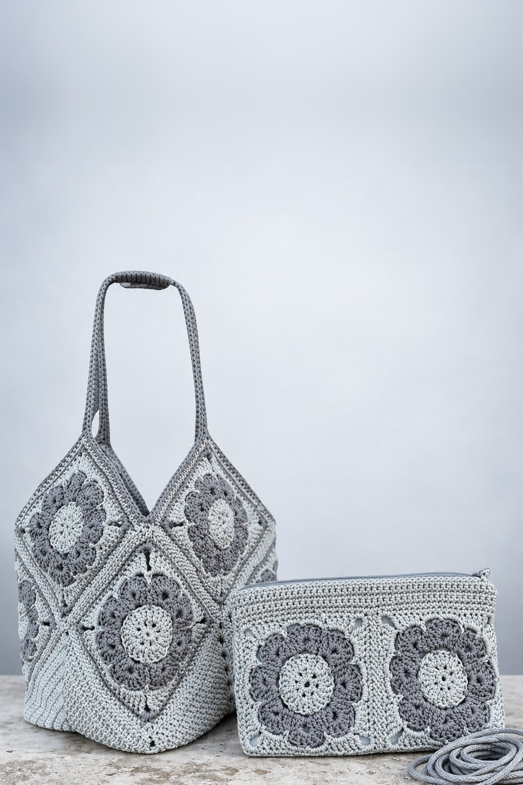 Grey crochet granny-square tote bag and zip pouch made from cotton macrame cord